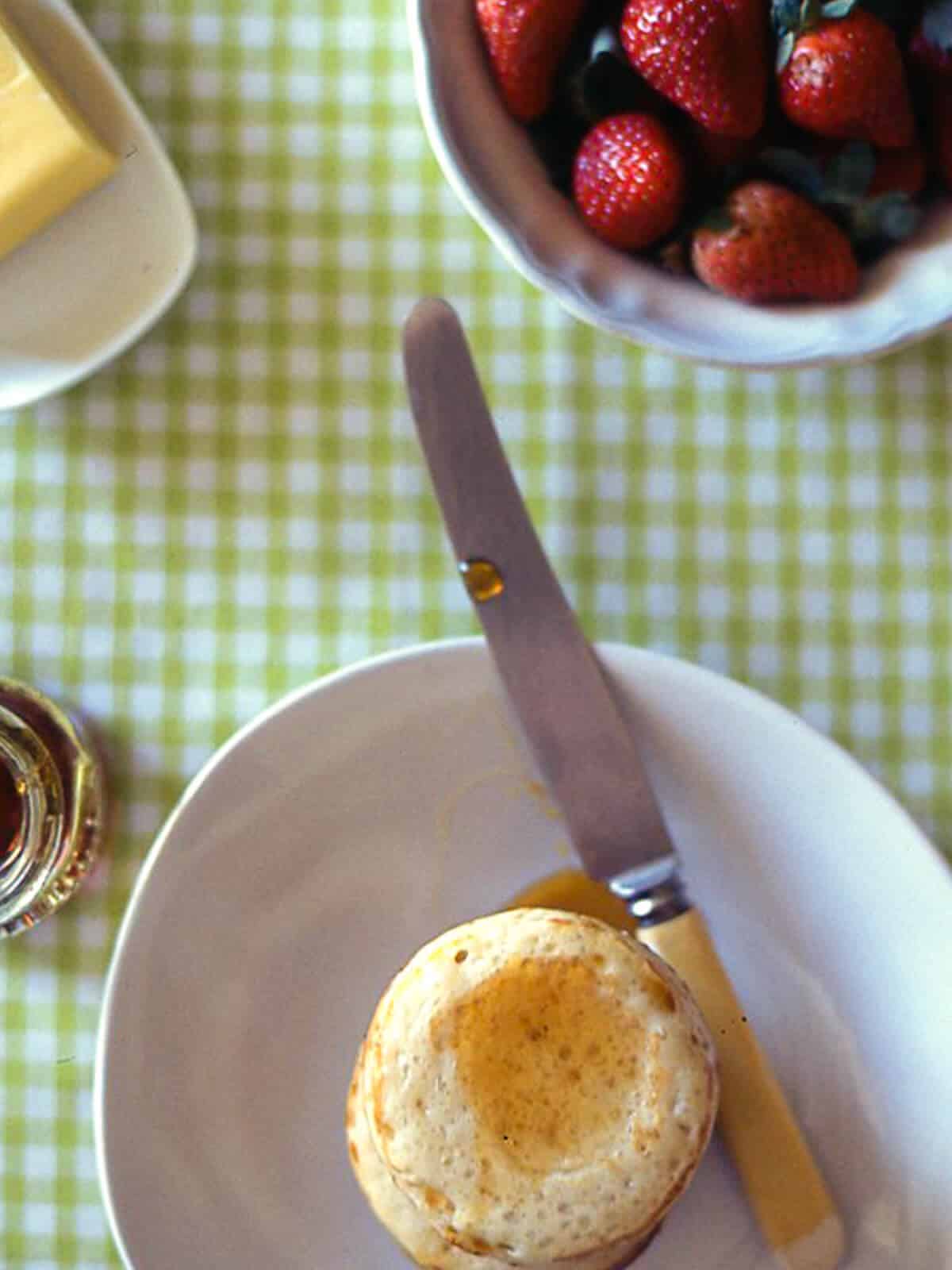 homemade crumpets served on a plate with a knife