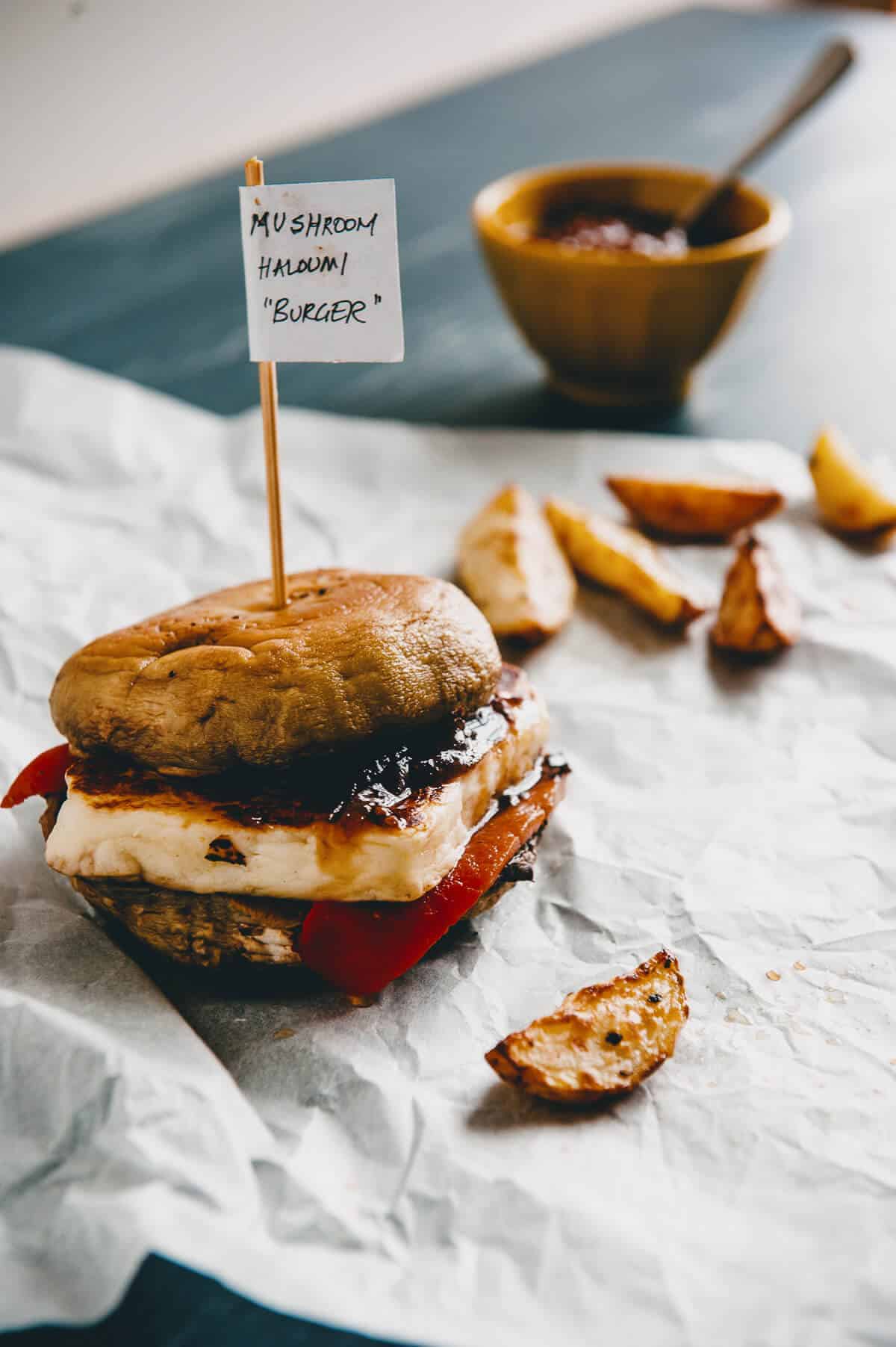 a piece of halloumi cheese sandwiched between two mushrooms