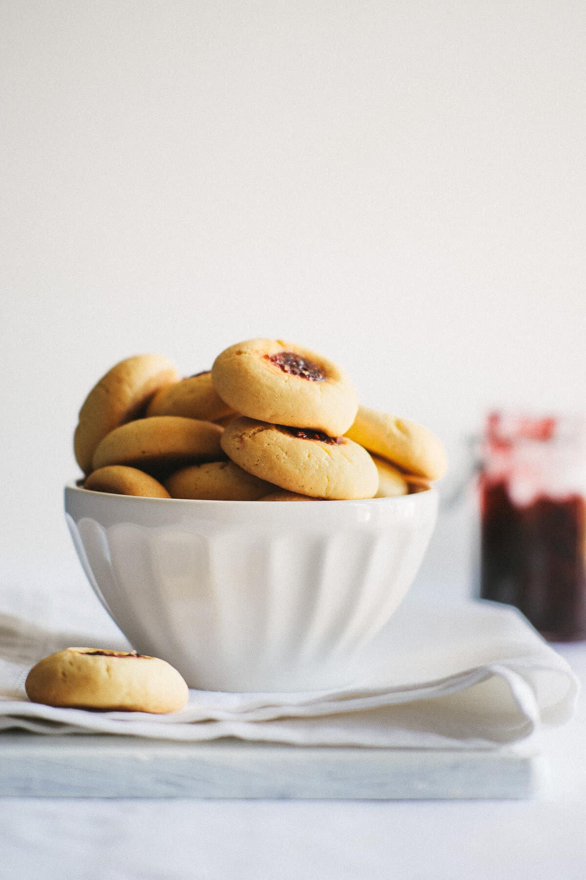 a white bowl filled with biscuits