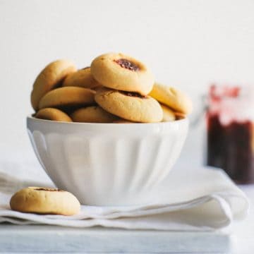 a white bowl filled with biscuits