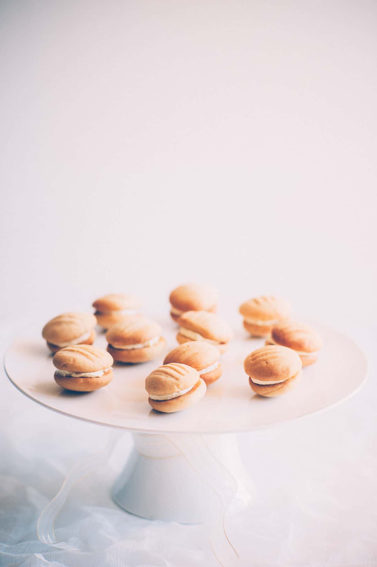 a selection of cookies presented on a cake stand