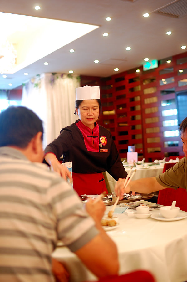 lady serving yum cha Hong Kong