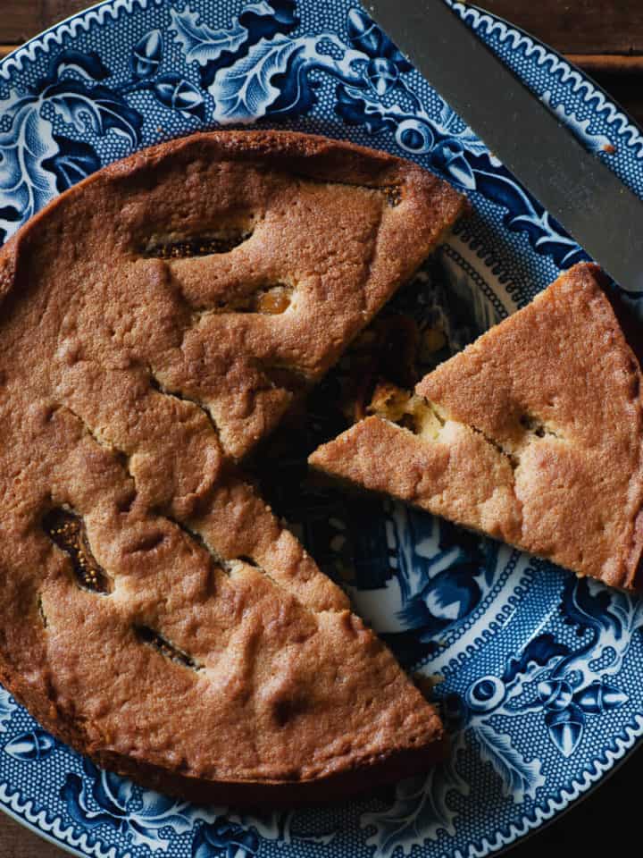 a dried fig cake served on a blue plate