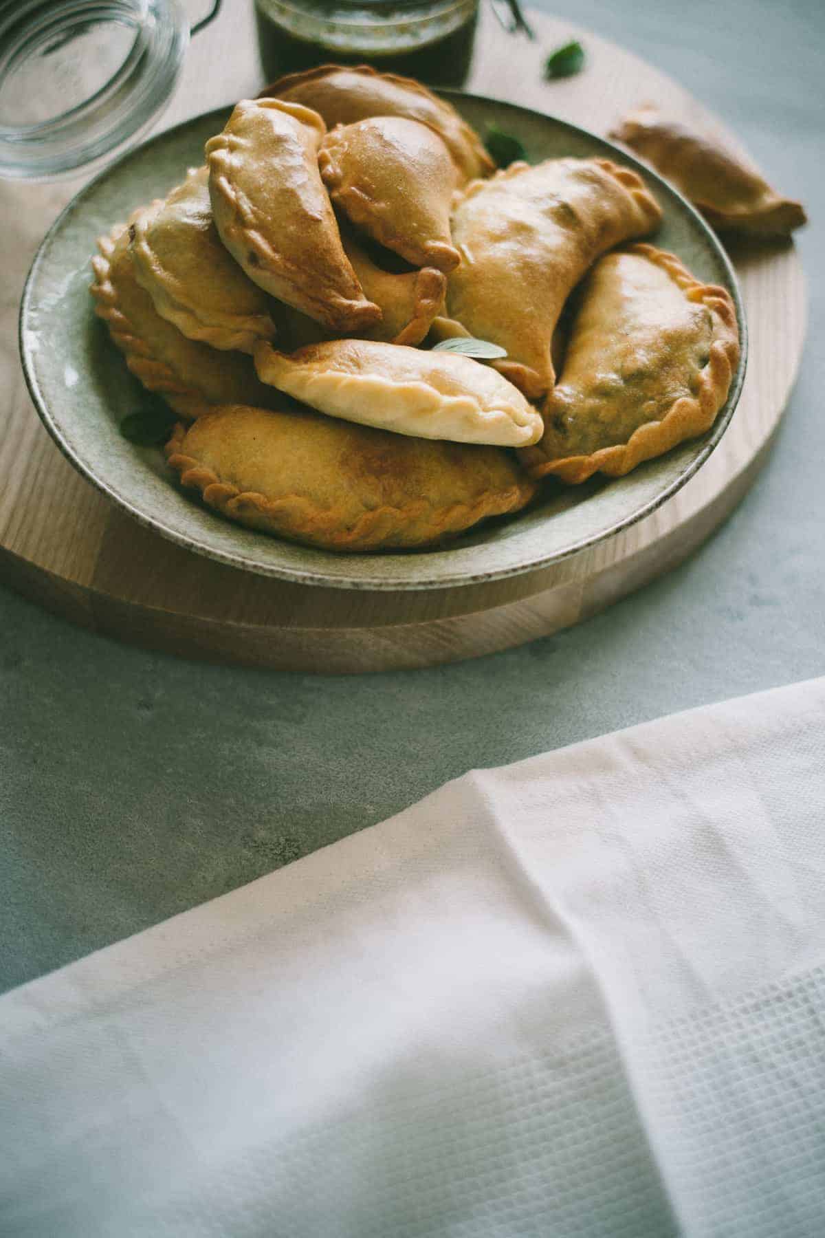 Lamb Empanadas with an oregano chimichurri dipping sauce