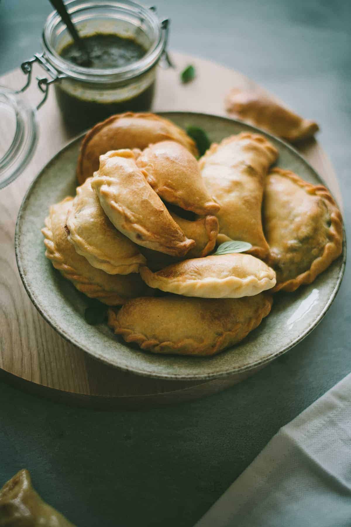 Lamb Empanadas with an oregano chimichurri dipping sauce