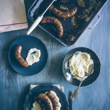 bangers and mash prepared and served on plates