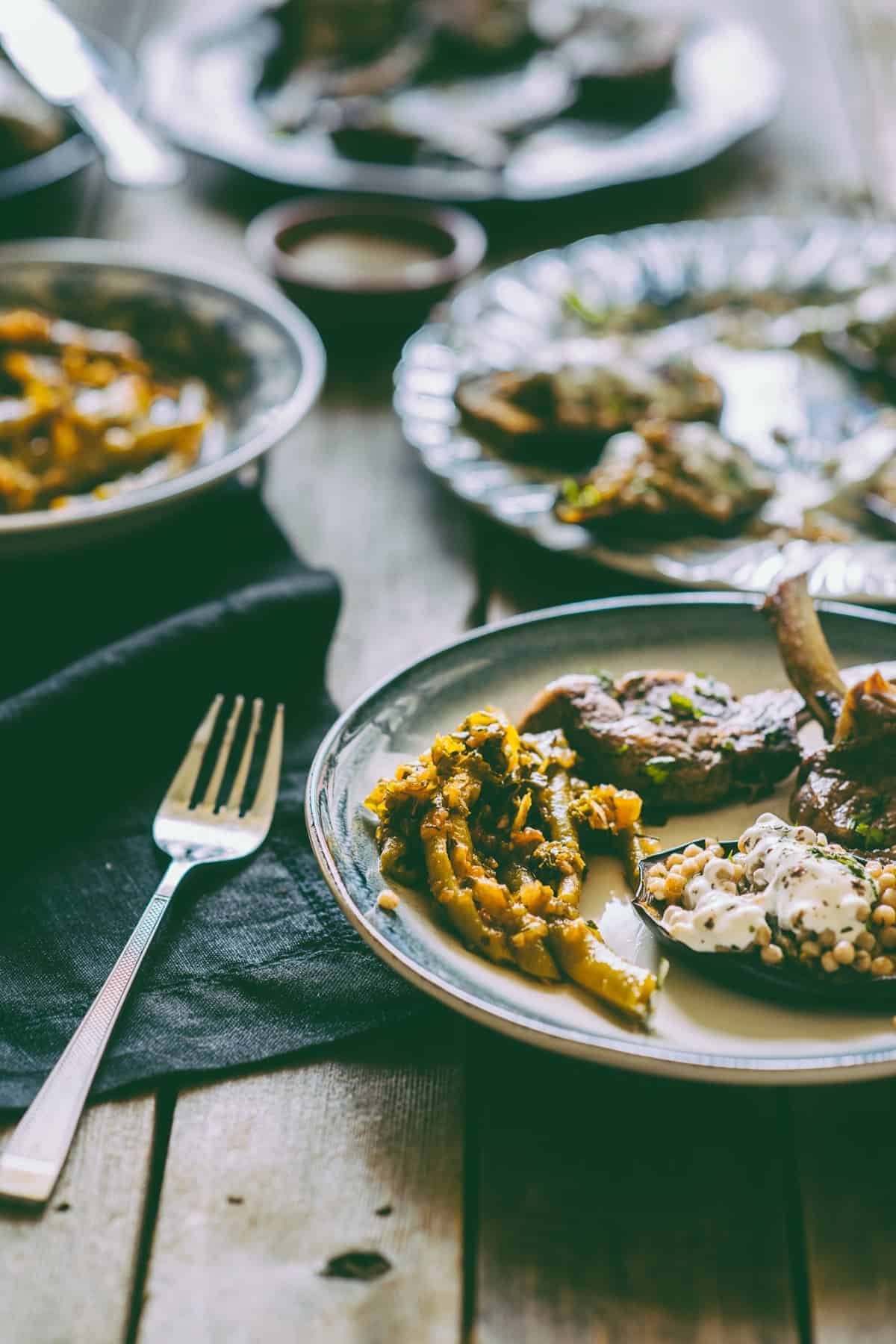 Middle Eastern style lamb cutlets with Israeli couscous stuffed eggplants