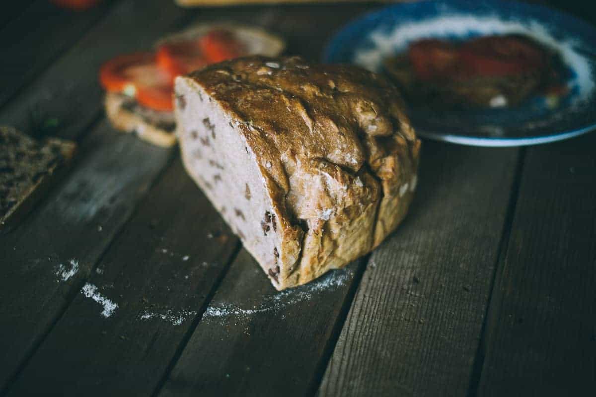 no knead olive spelt bread sliced in half