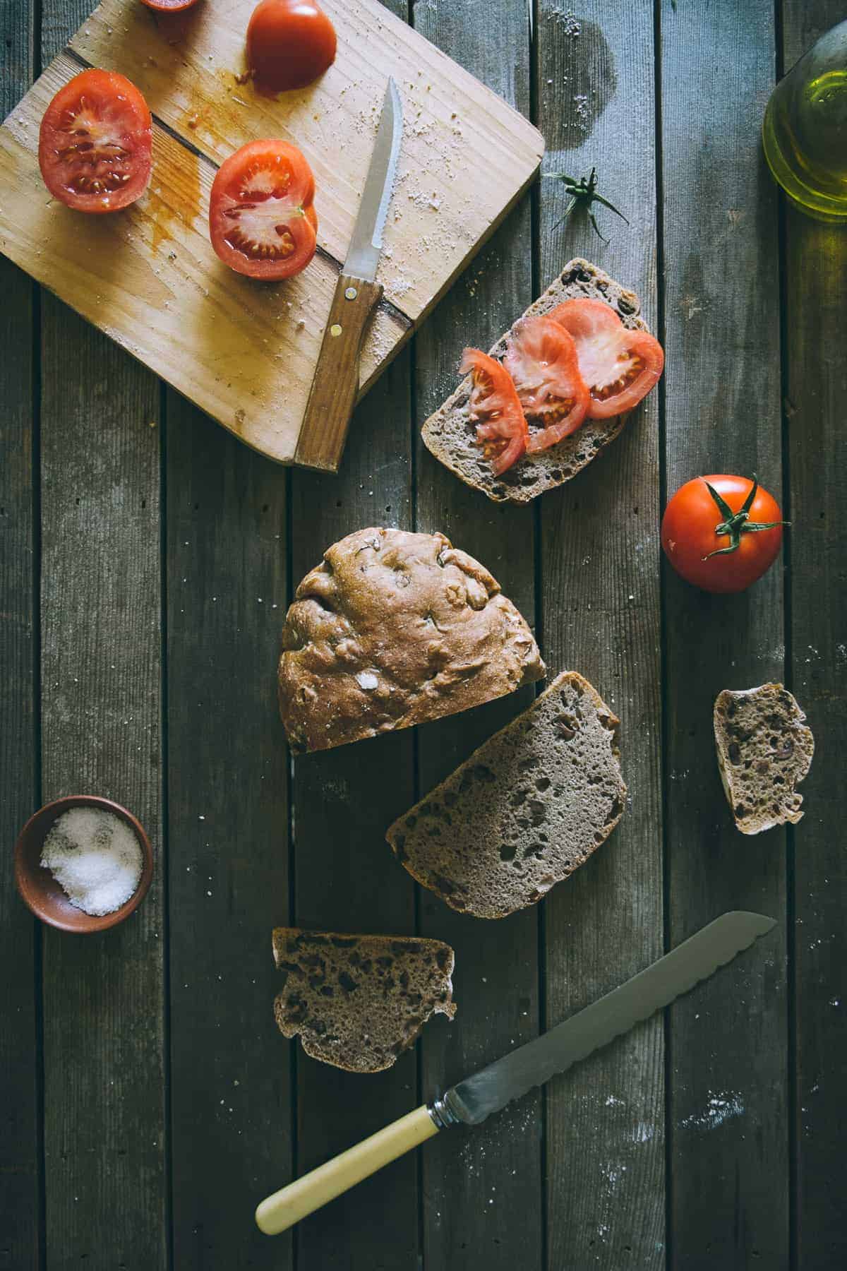 tomato slices on no knead olive bread