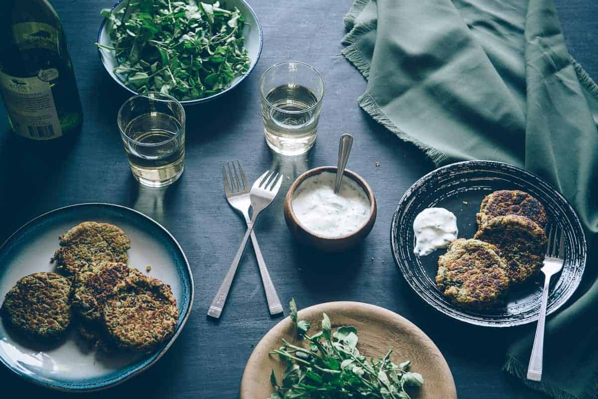 lentil cakes served with yoghurt and watercress