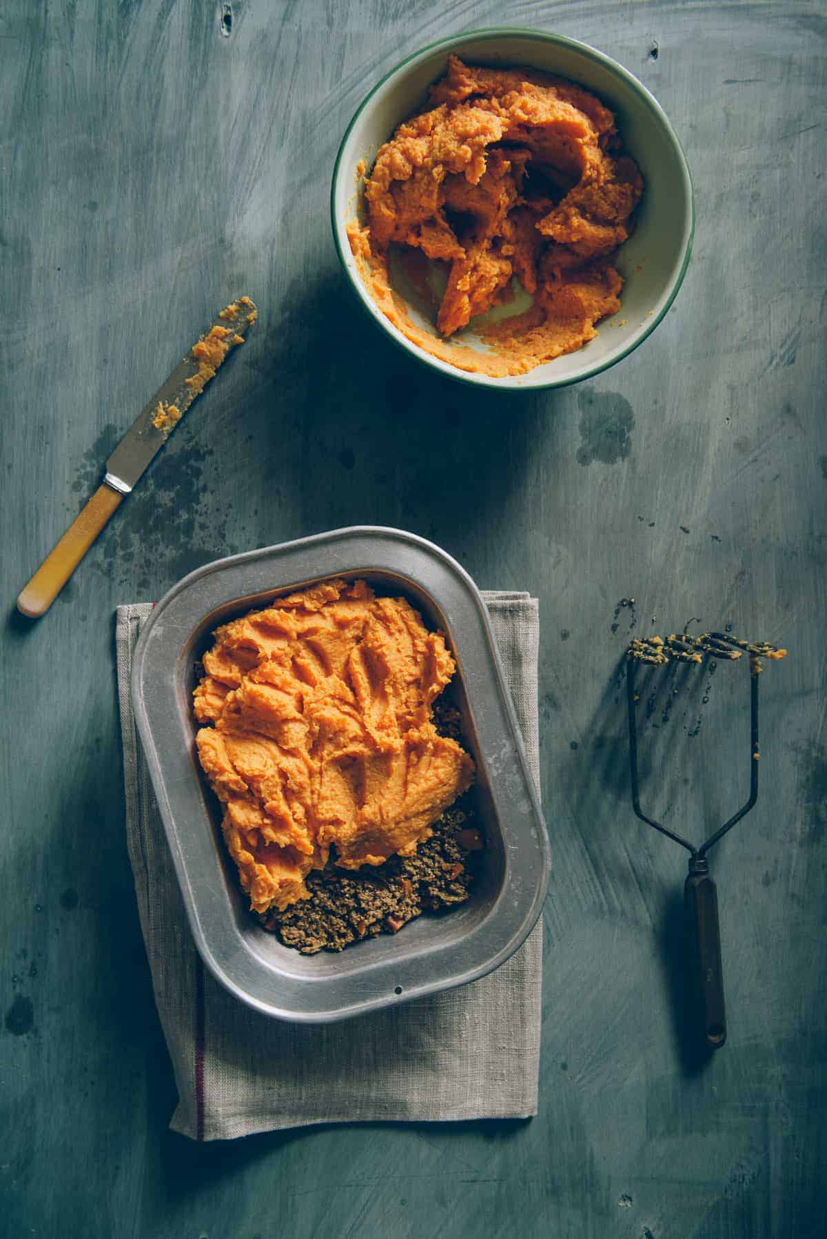 preparing shepherds pie with sweet potato topping