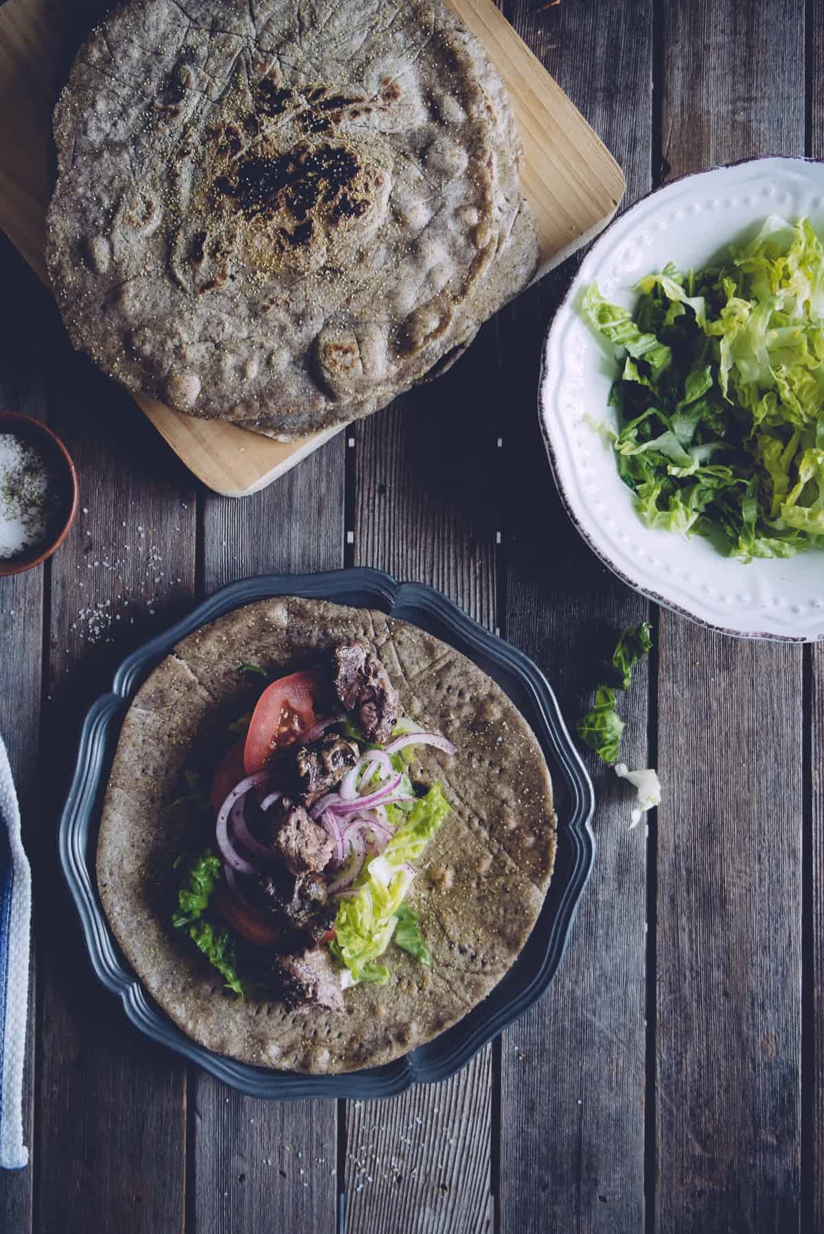 flat breads filled with meat and salad