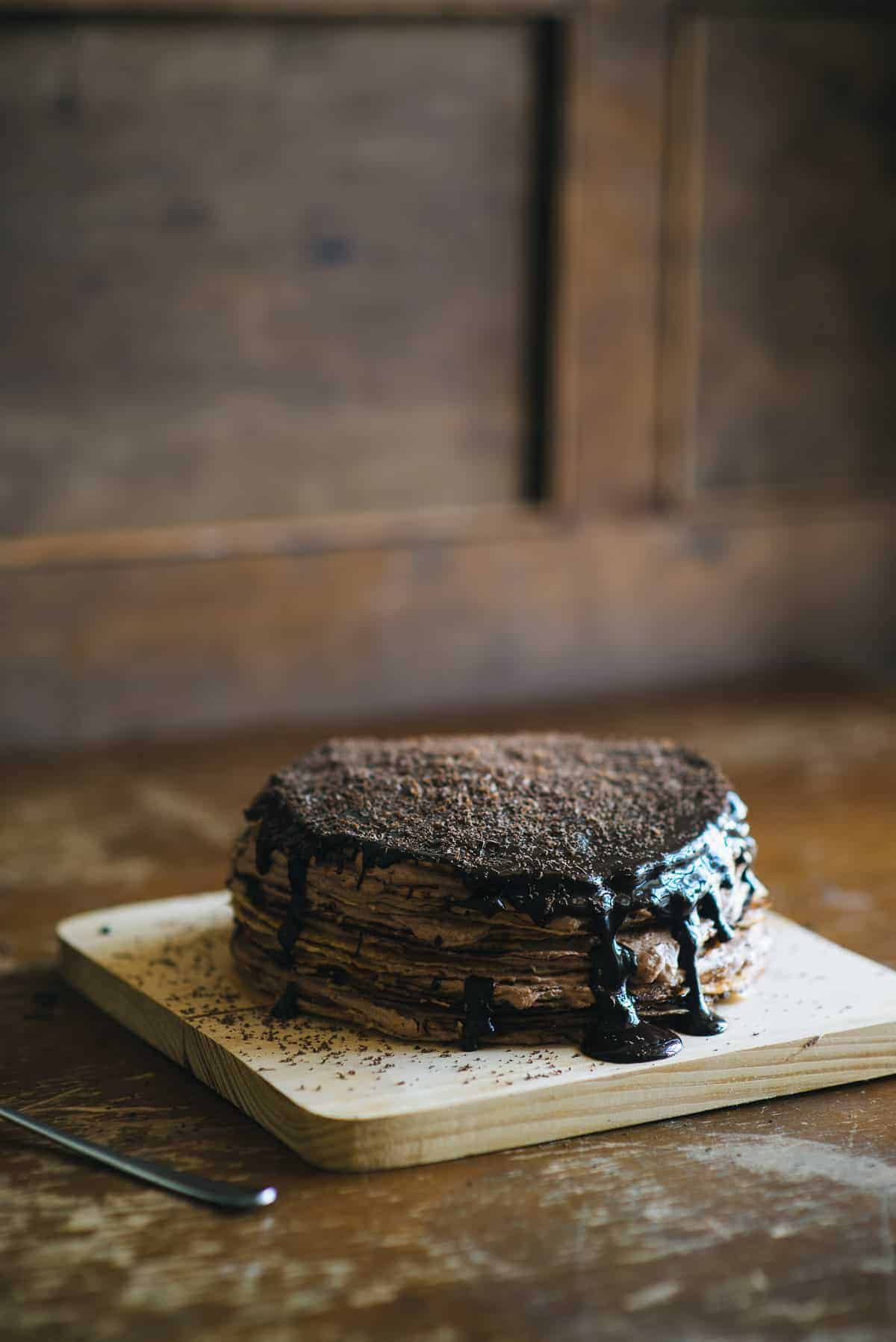 Nutella cream crepe cake with melted chocolate