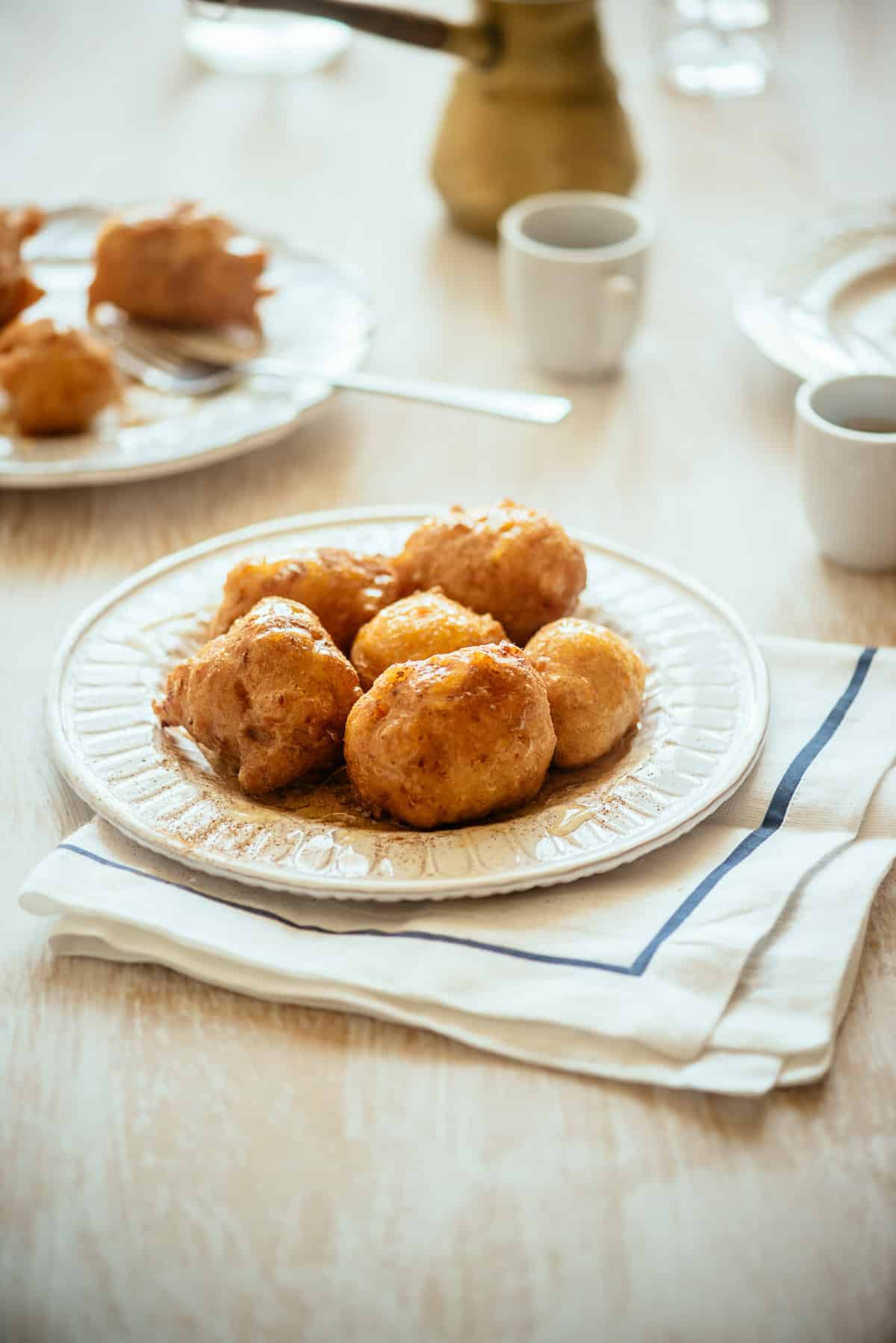 Greek sweet potato doughnuts served on a plate