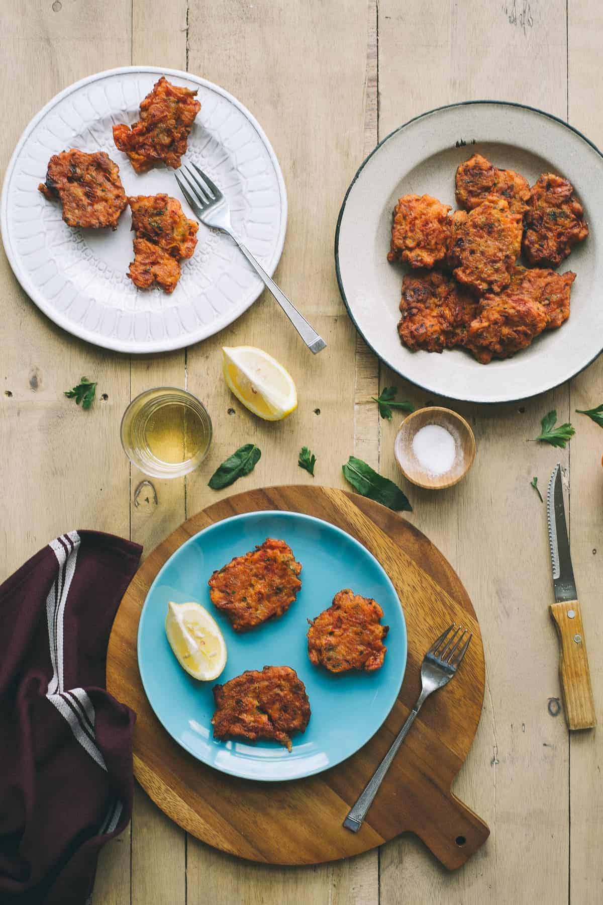 tomato fritters or domatokeftedes served on 3 different plates