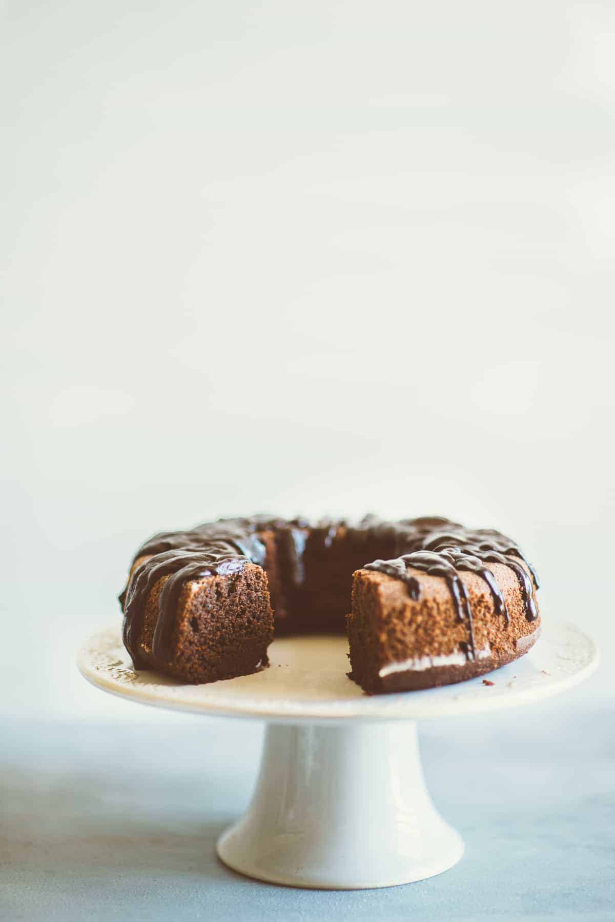 a cut cake on a cake stand