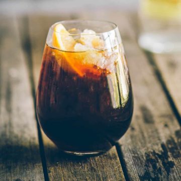 a glass filled with a cocktail made with coffee