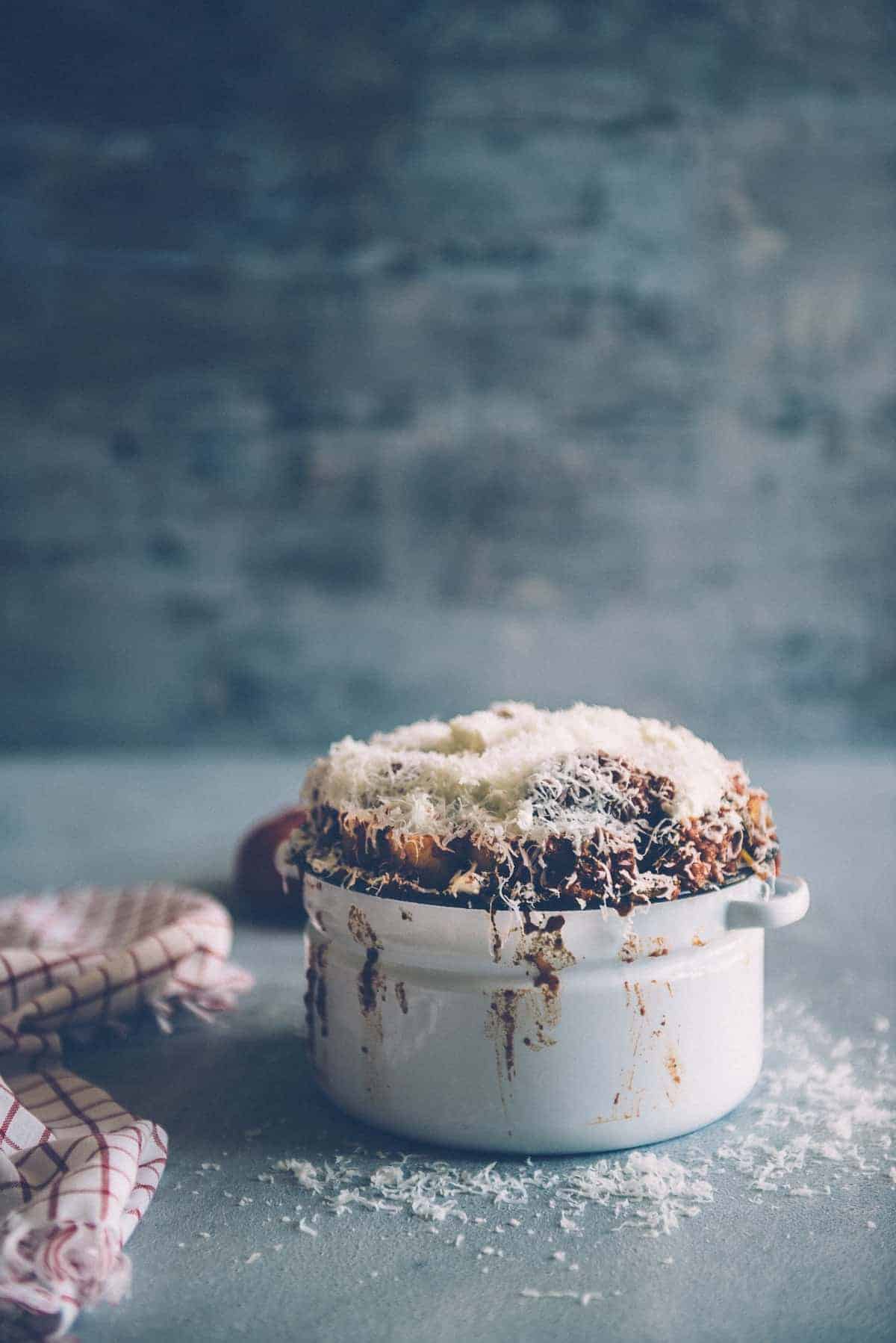 baked pasta smothered in grated Parmesan Cheese