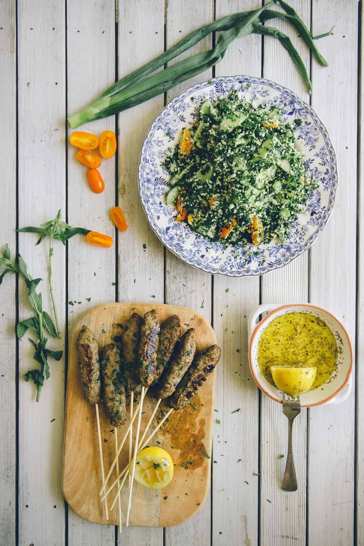 beef kofta with grain free tabouli served on a table