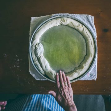 rolling out a homemade pie