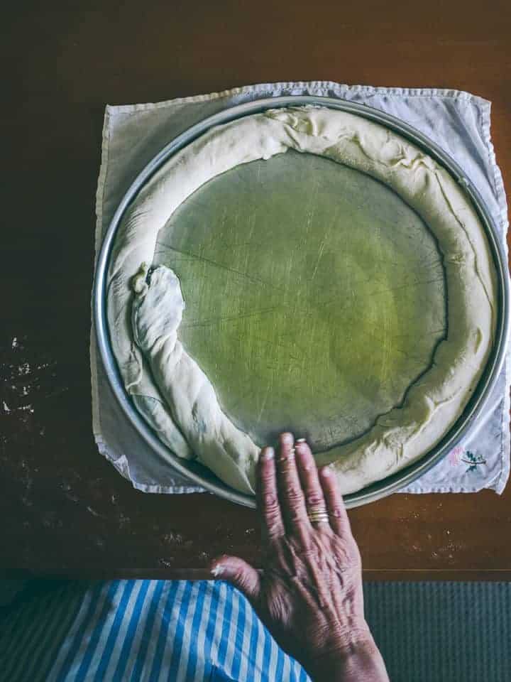 rolling out a homemade pie