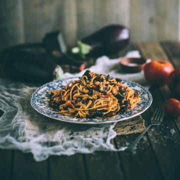 pasta with eggplants and tomatoes served on a plate