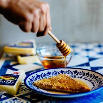 honey being drizzled over fried cheese