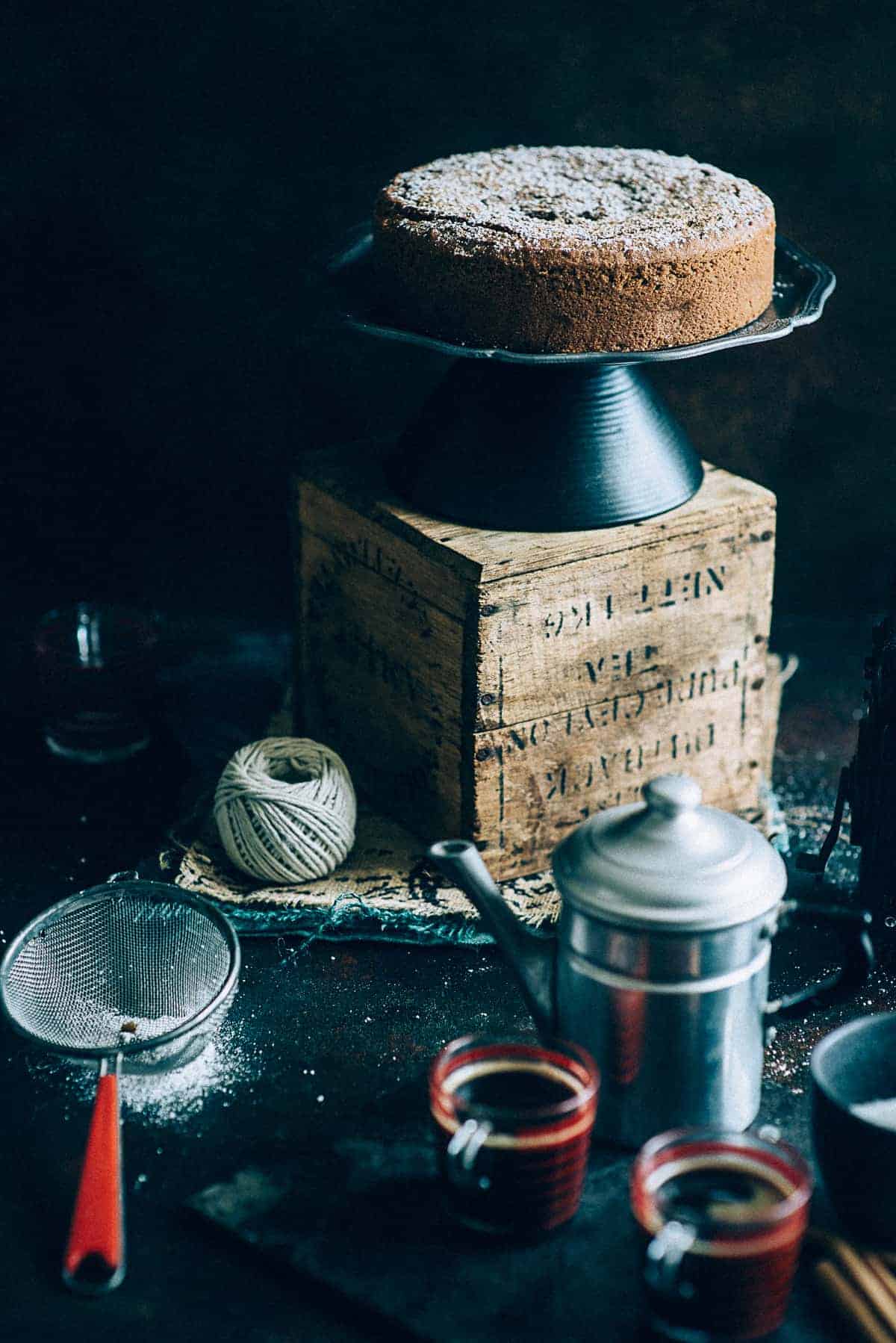 a vegan cake made with tahini on a cake stand