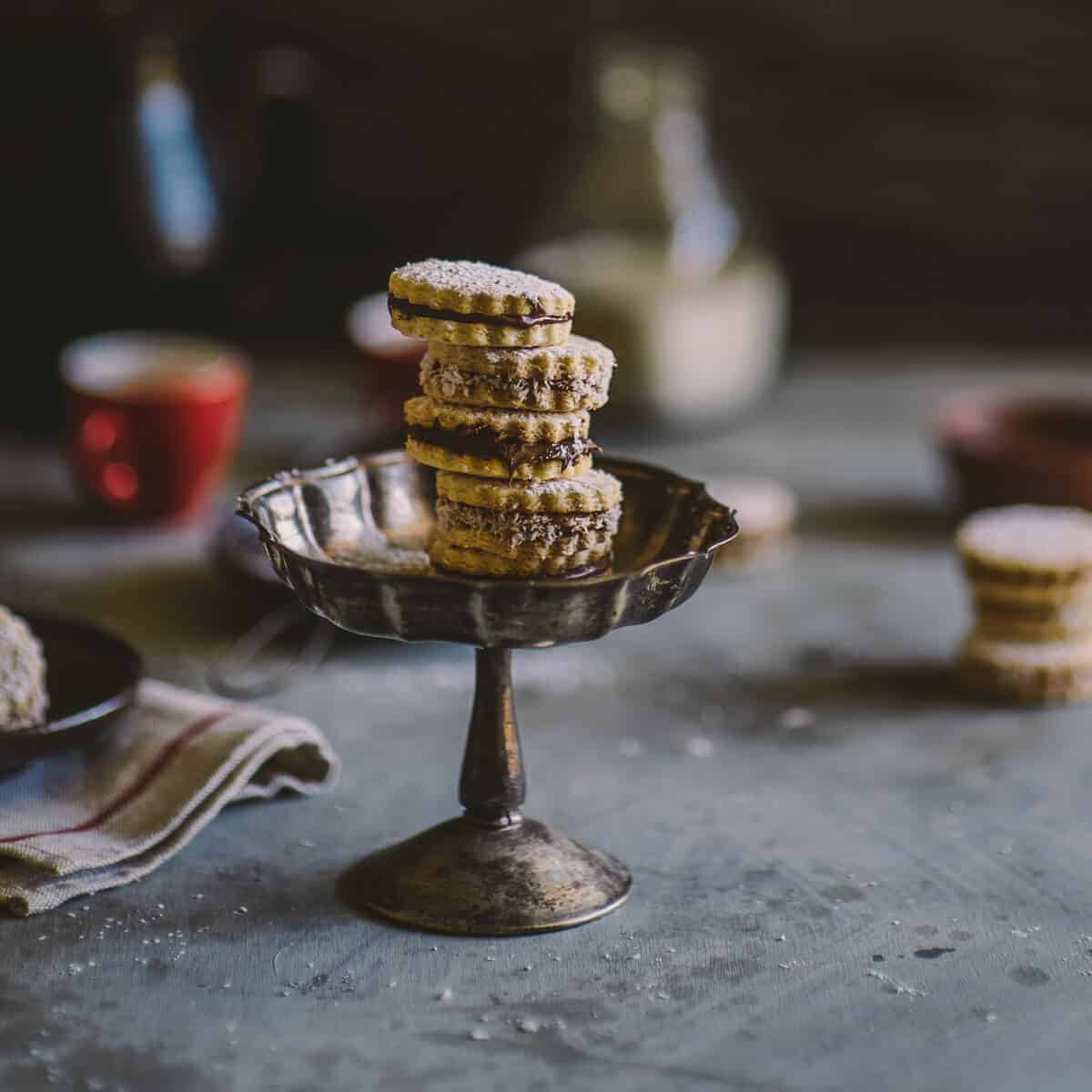 alfajores cookies served on a fluted stand