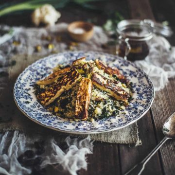 a salad made with cauliflower and halloumi served on a plate