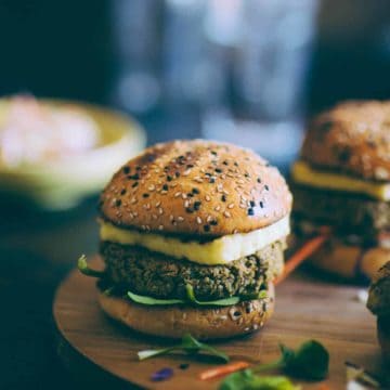 a burger made with chickpeas and quinoa and topped with halloumi cheese