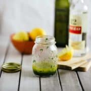 a salad dressing inside an old jam jar