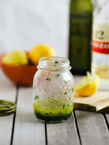 a salad dressing inside an old jam jar