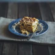 baked pasta dish served on a blue plate on table