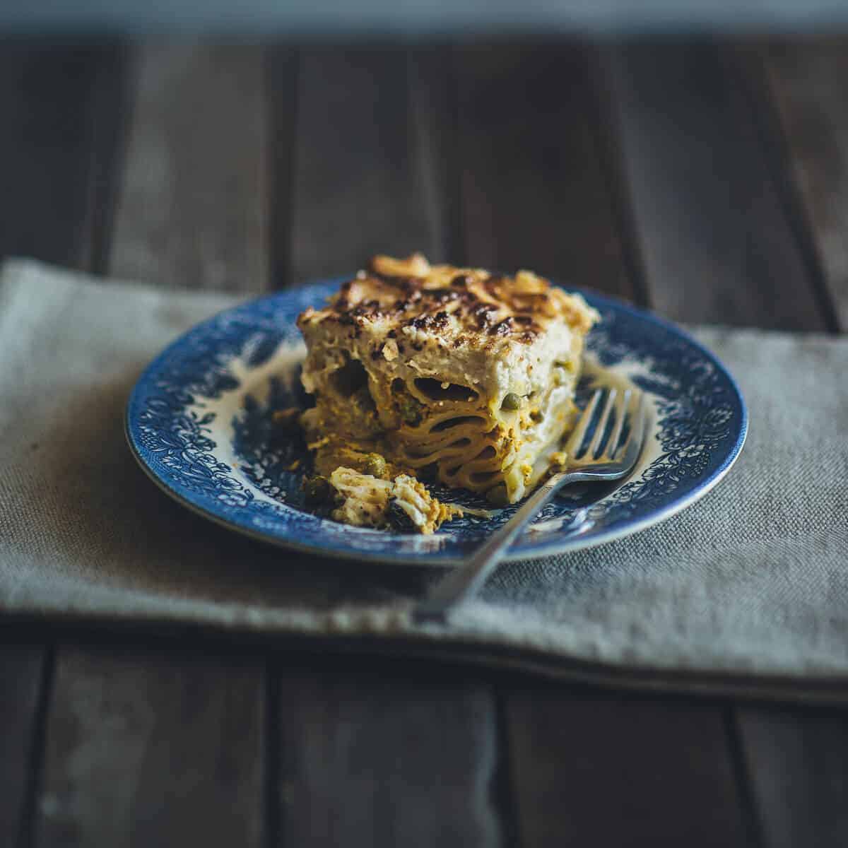 baked pasta dish served on a blue plate on table