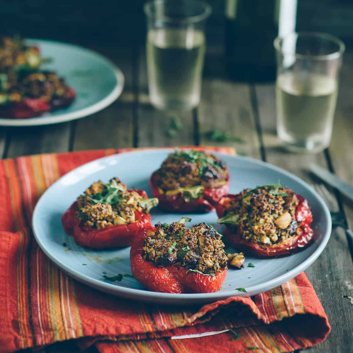 peppers stuffed with quinoa served on a plate
