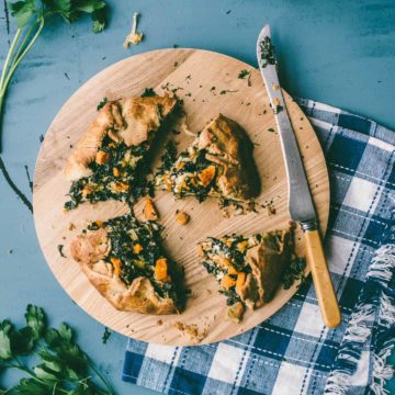 a cut pie served on a chopping board