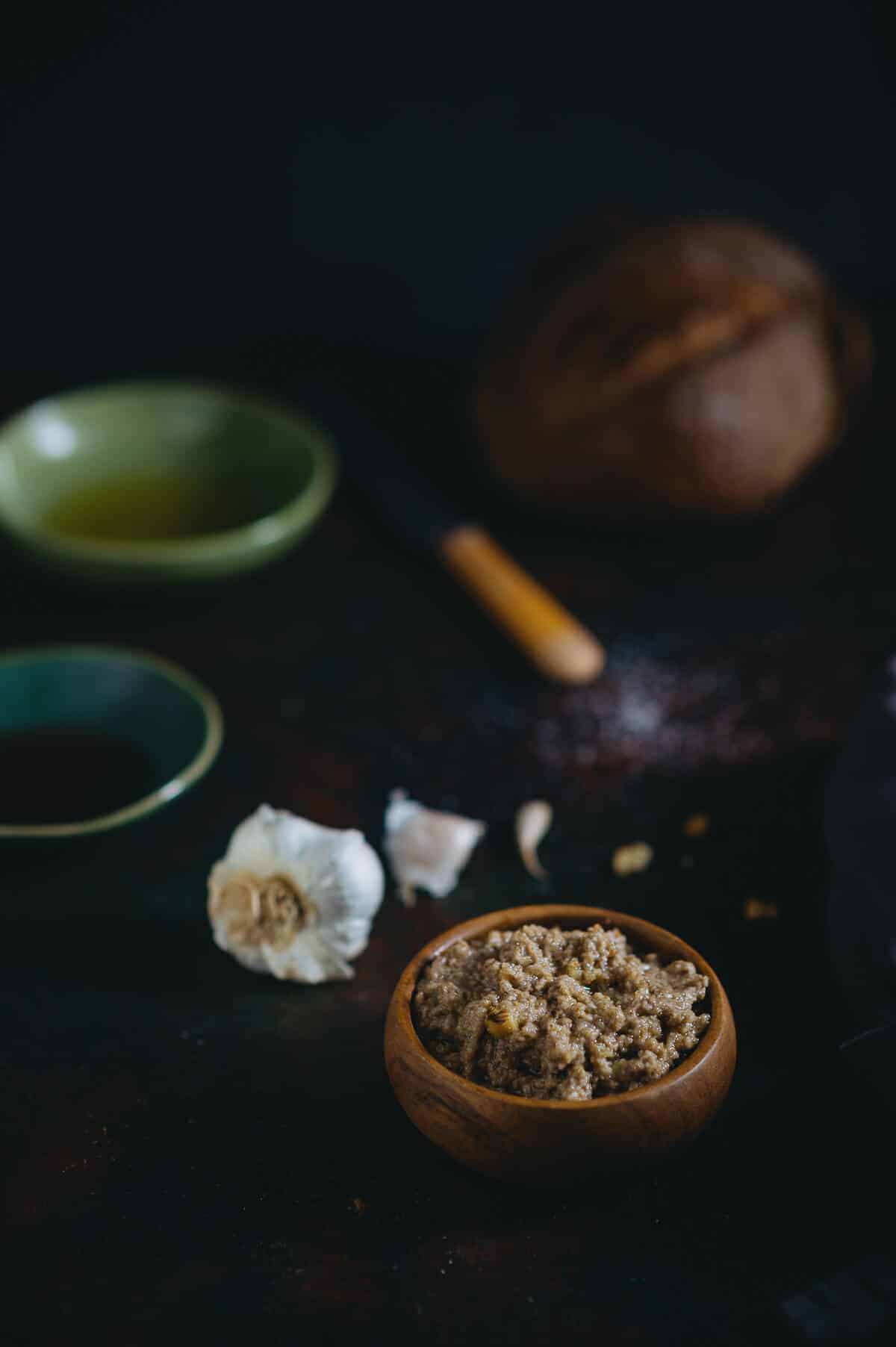 walnut dip served in a wooden bowl