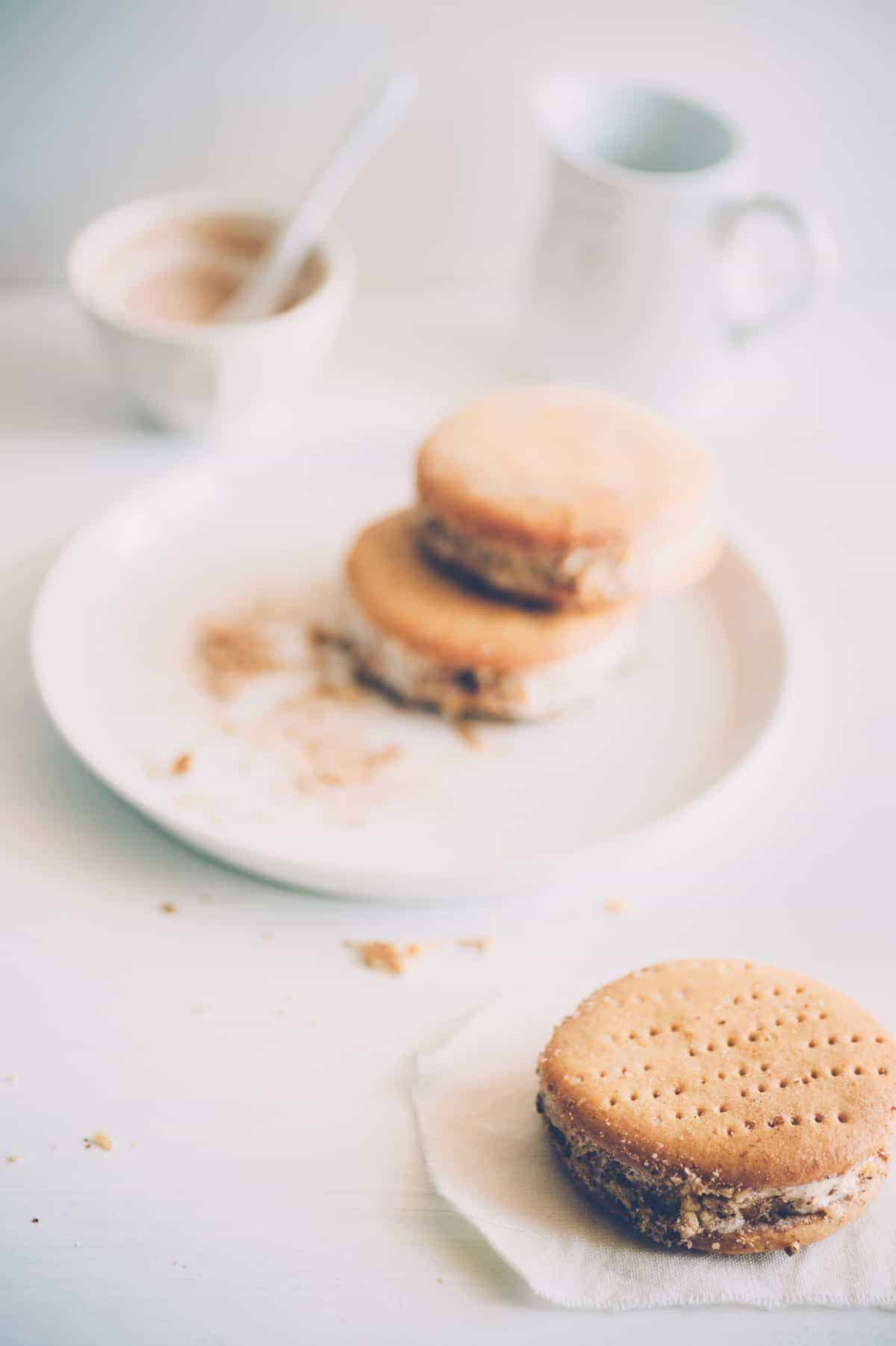 three ice cream sandwiches made with cinnamon ice cream - all three are on a white surface