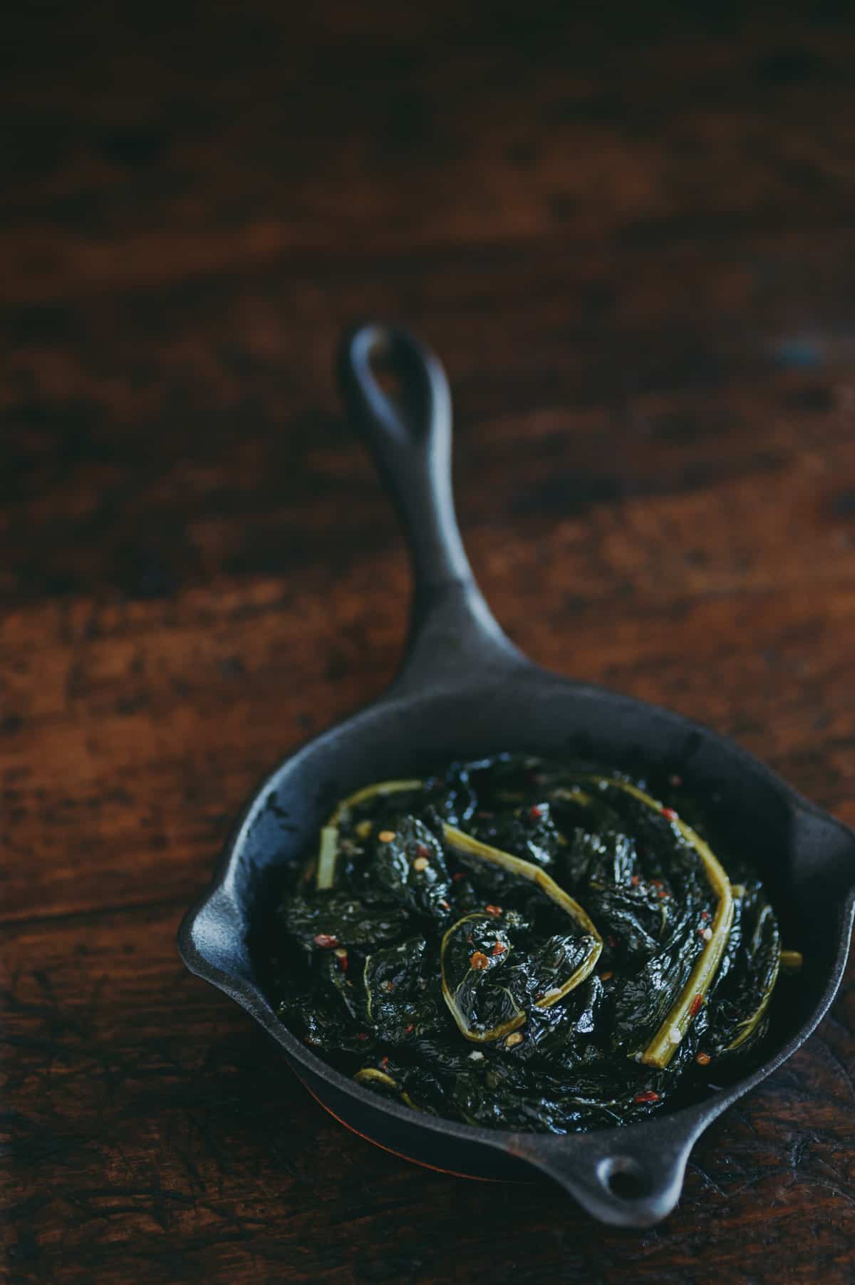 braised cavolo nero in a cast iron pan