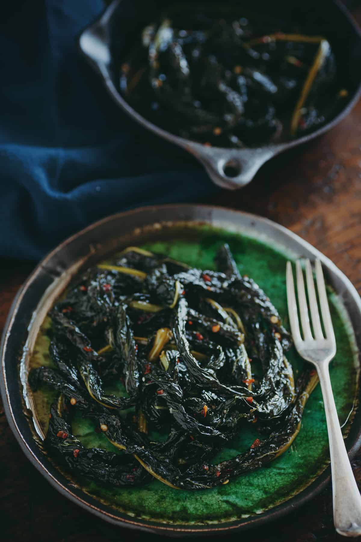 braised cavolo nero on a green plate