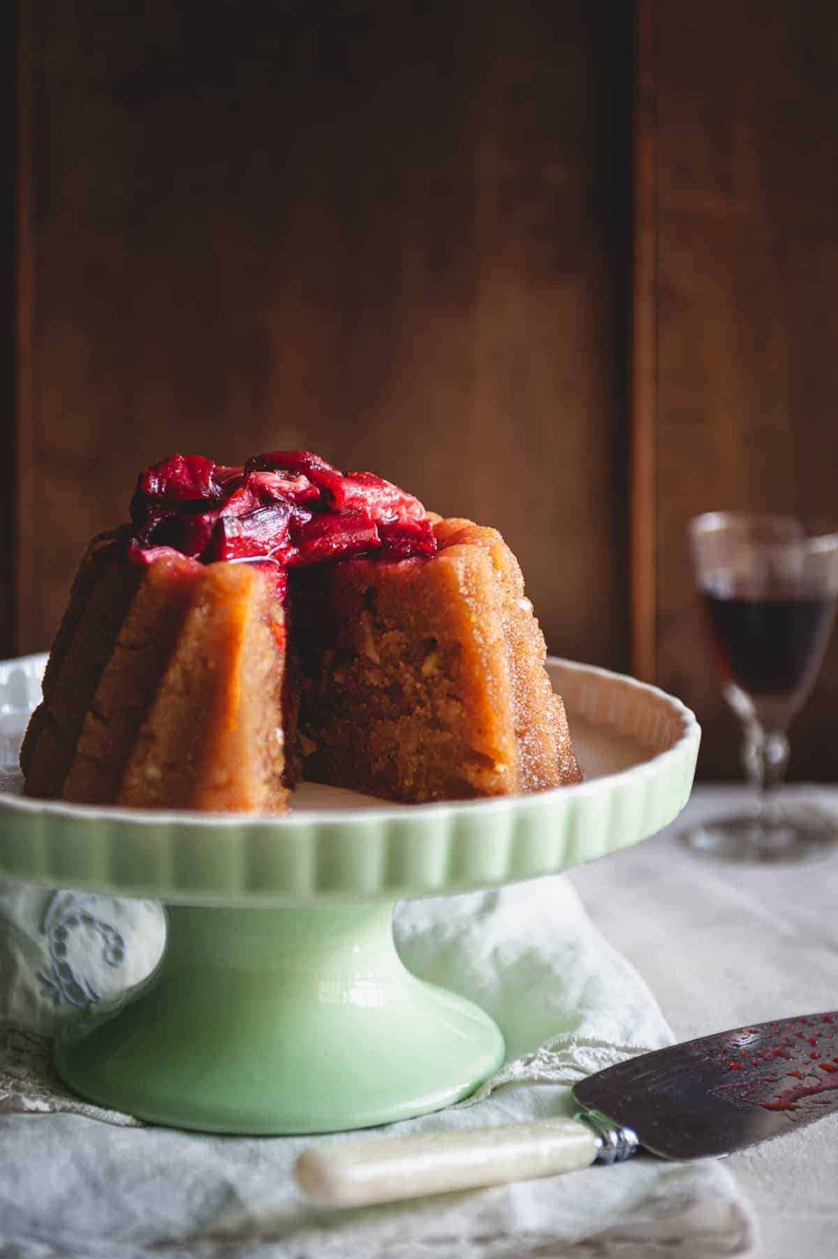 a Greek dessert known as halva on a cake stand served with a rhubarb compote