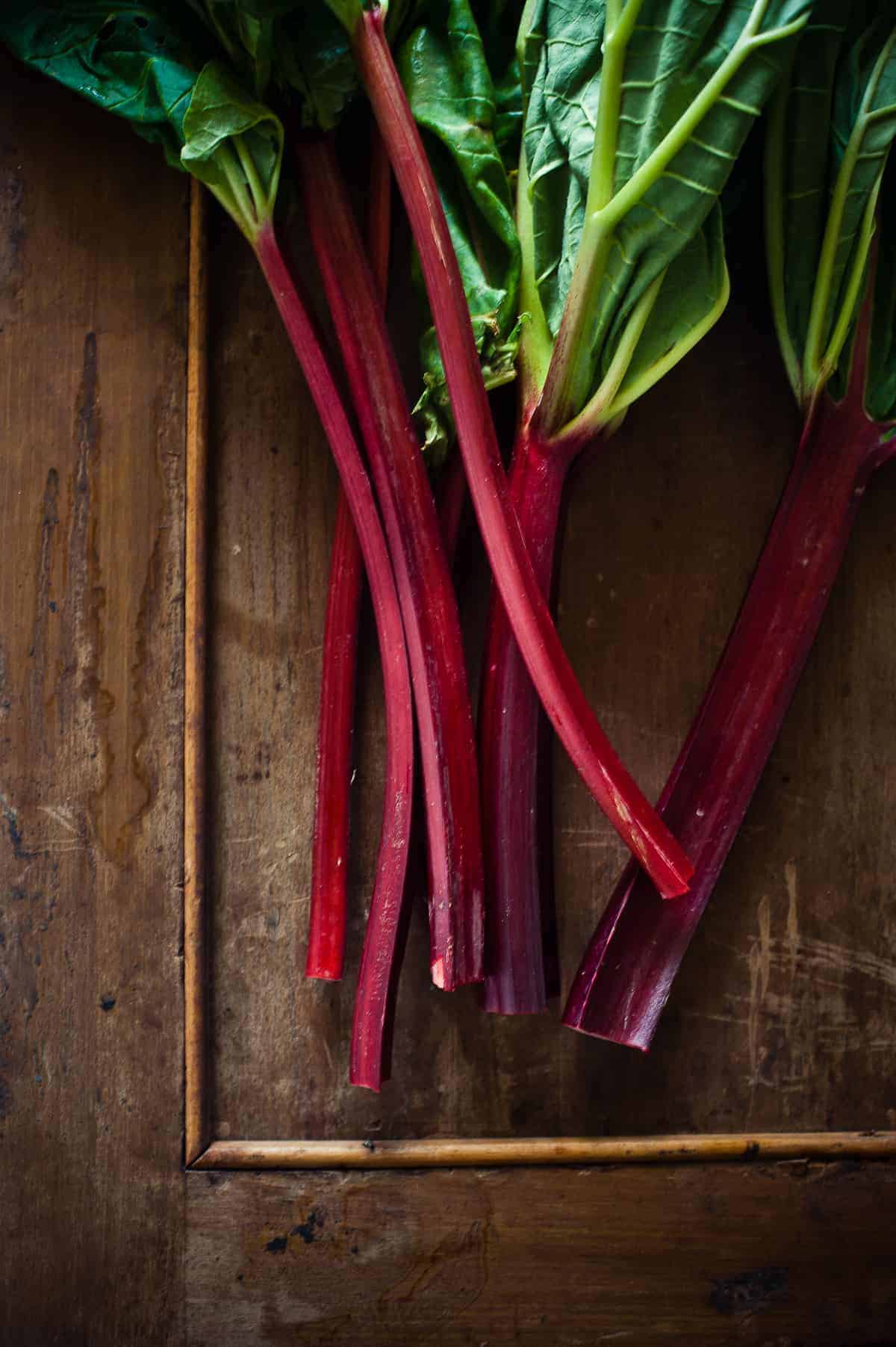 rhubarb stalks on a wooden board