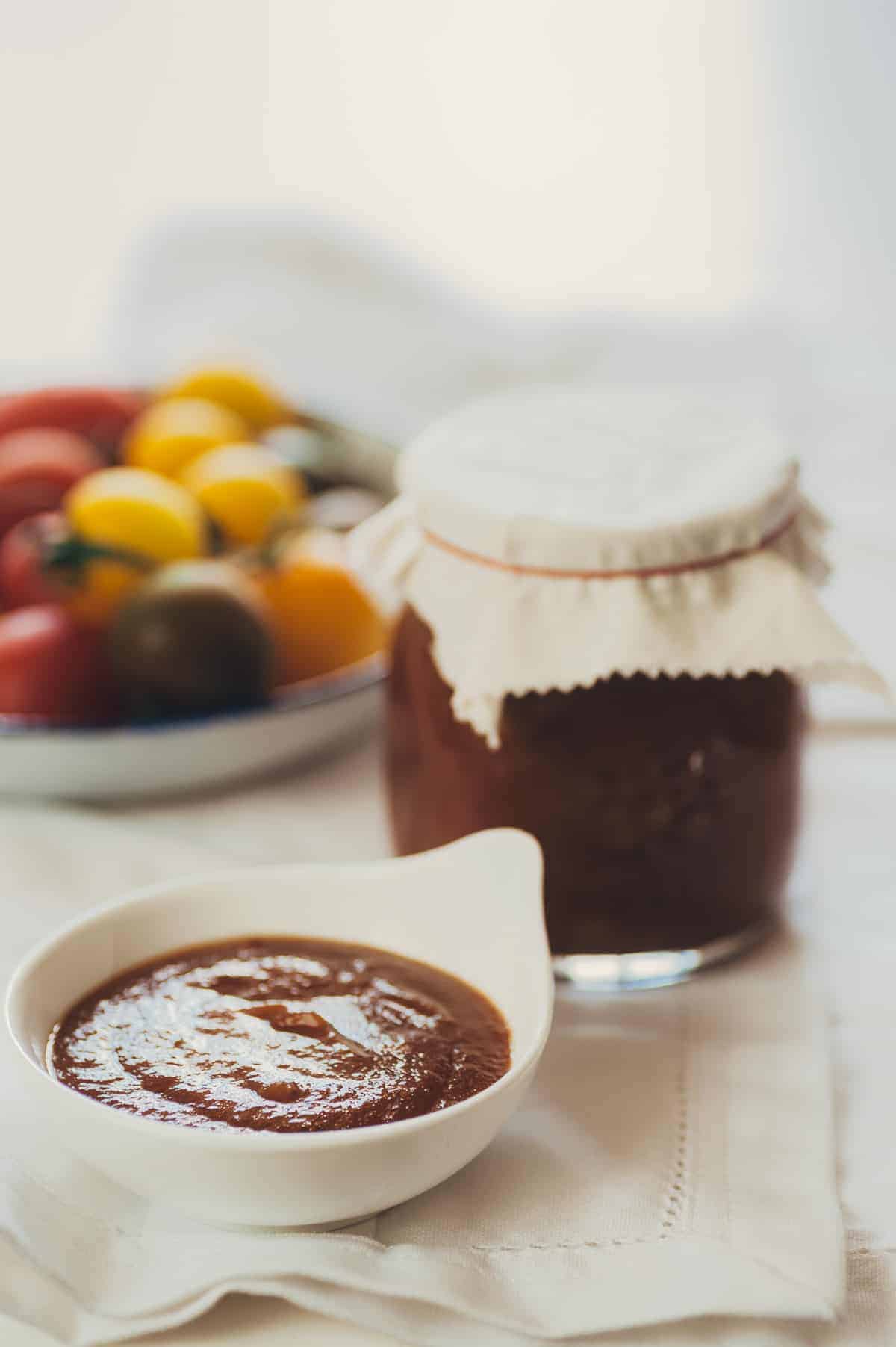 a small ramekin filled with homemade tomato ketchup on a table 