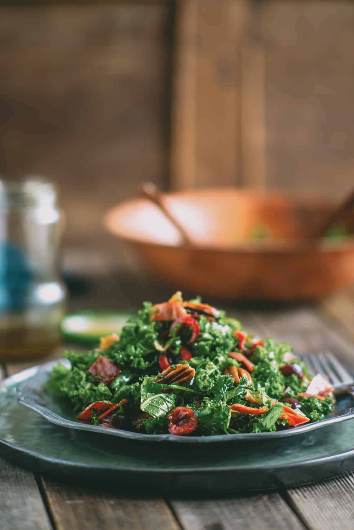 a kale salad served in a silver plate