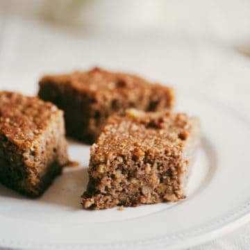 close up of three pieces of Greek walnut cake served on white plate