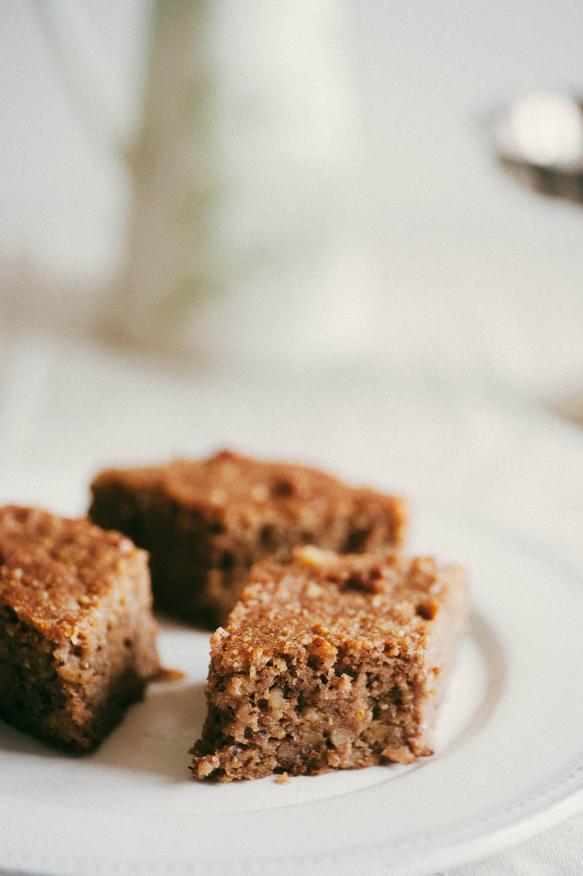 close up of three pieces of Greek walnut cake served on white plate