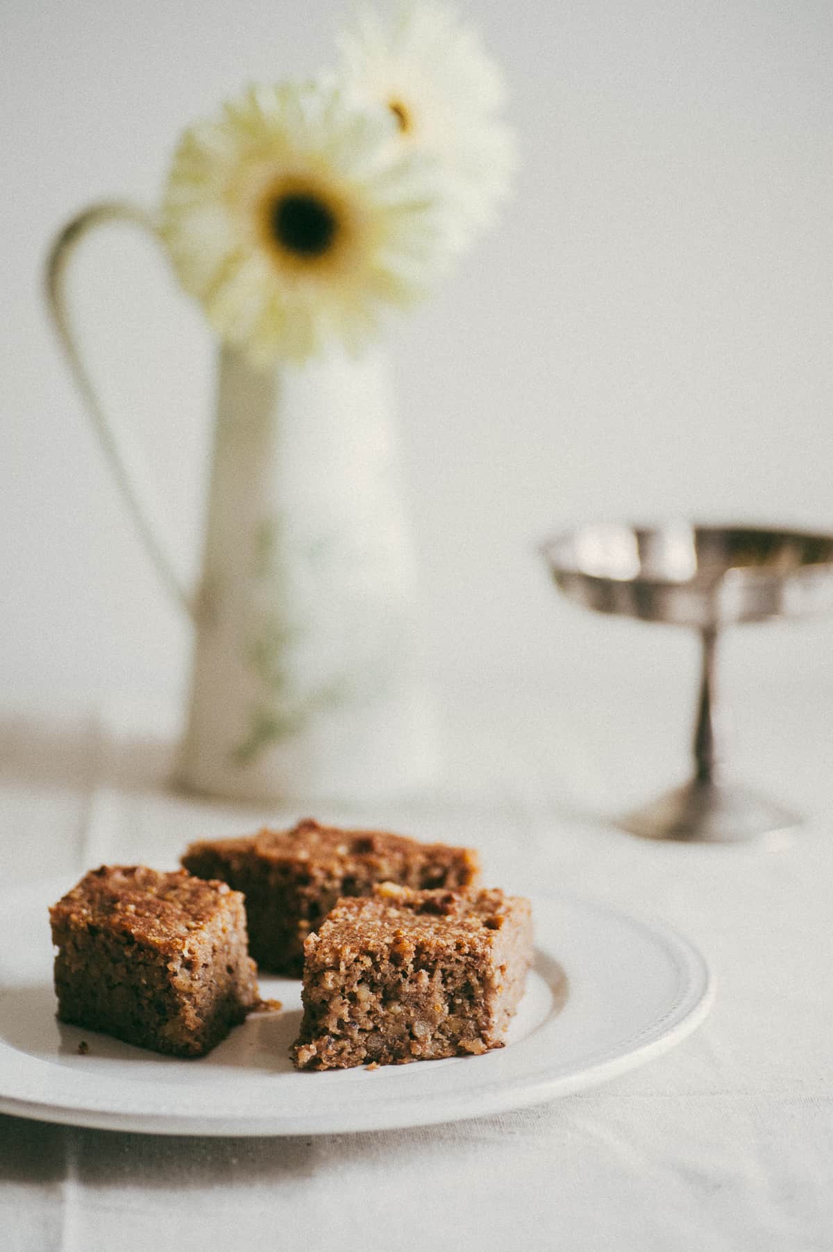 three pieces of Greek walnut cake served on white plate