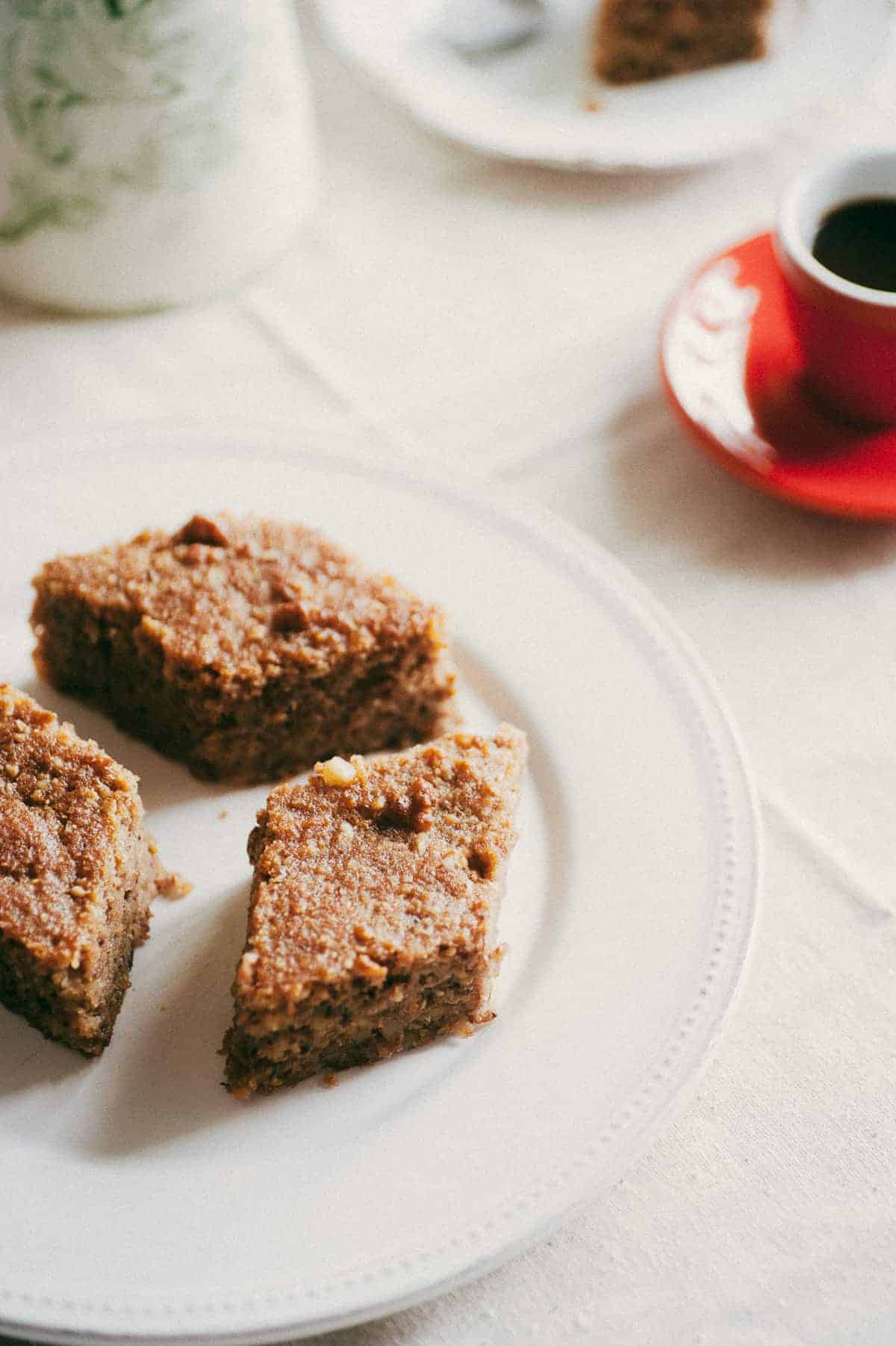 three pieces of greek walnut cake on a white plate