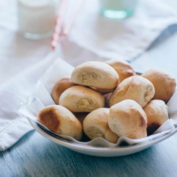 a bowl filled with pan de leche - a sweet bread made with milk